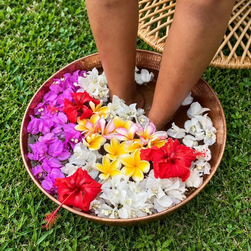Foot bath in a copper bowl with flowers